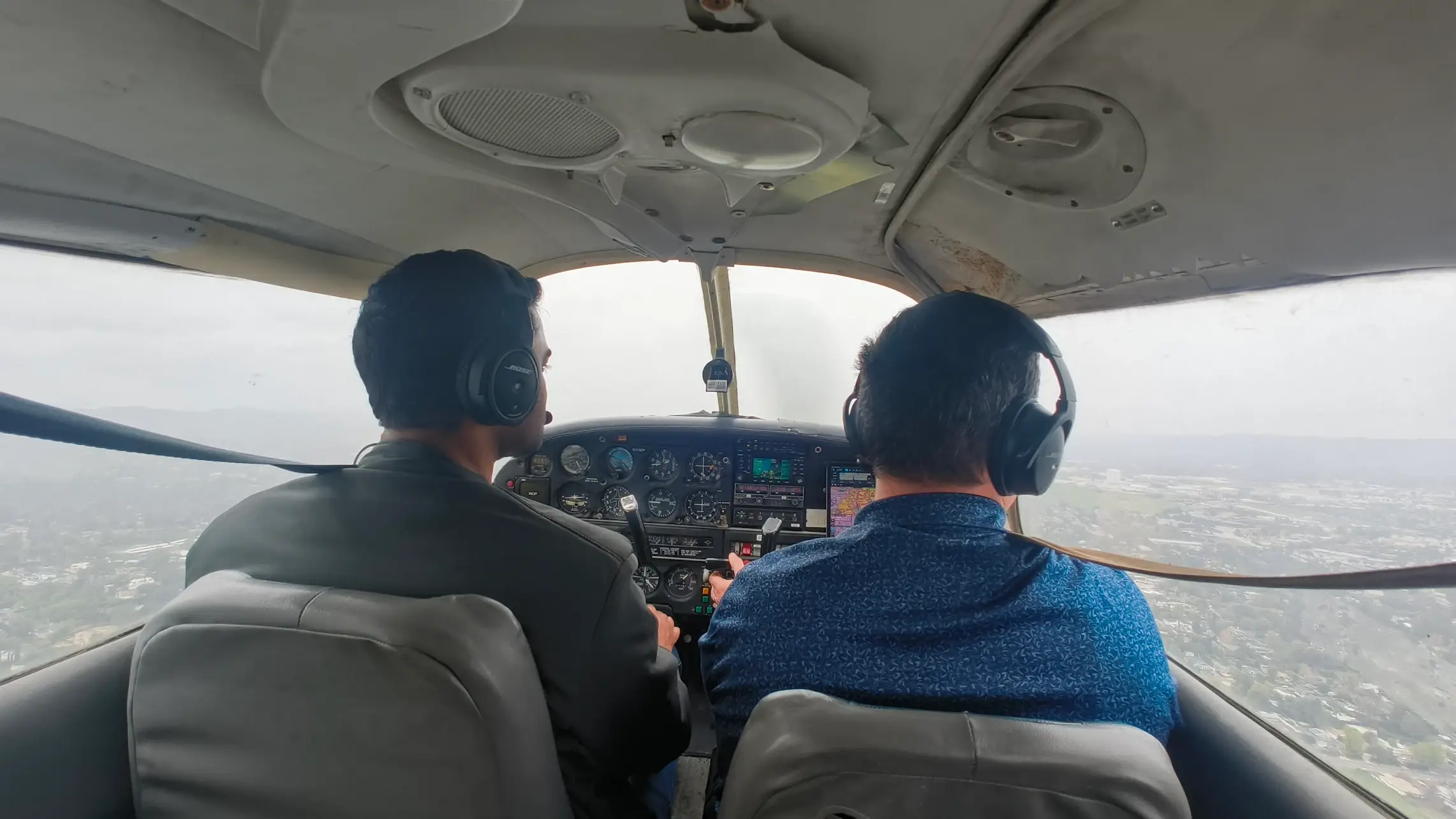 Students at Essence Flight School in Van Nuys Airport learning to fly in a Piper Archer cockpit